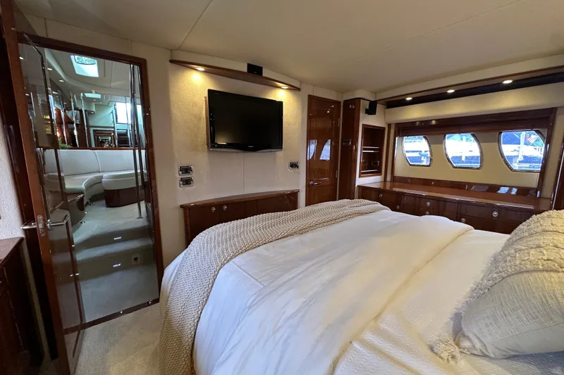 Slide: The Image of Luxurious 2009 Sea Ray 60 Sundancer yacht bedroom with elegant decor and modern amenities. - 27