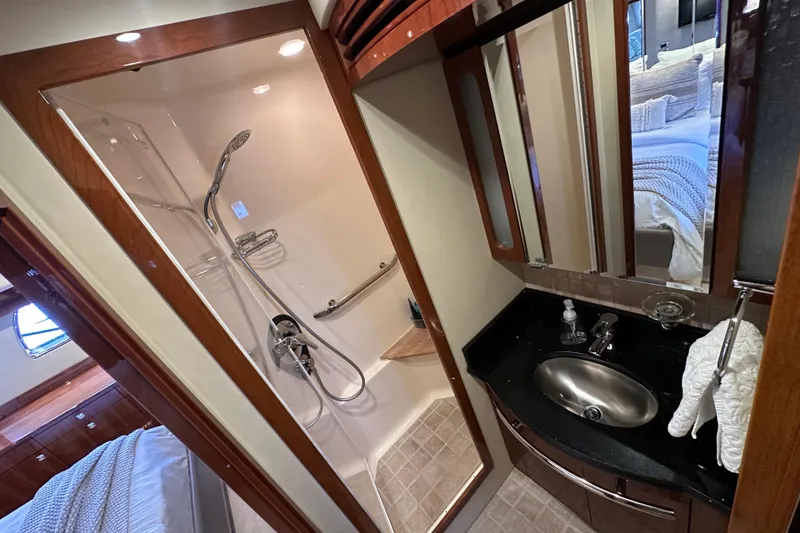 Slide: The Image of Luxurious bathroom in 2009 Sea Ray 60 Sundancer yacht with shower and sink. - 28