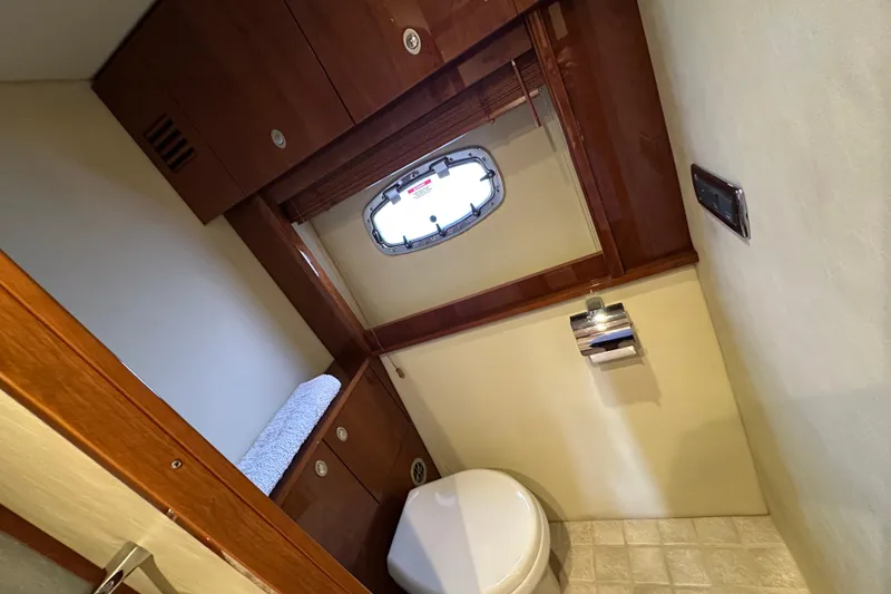 Slide: The Image of Luxurious bathroom interior of 2009 Sea Ray 60 Sundancer yacht with wooden cabinetry. - 29