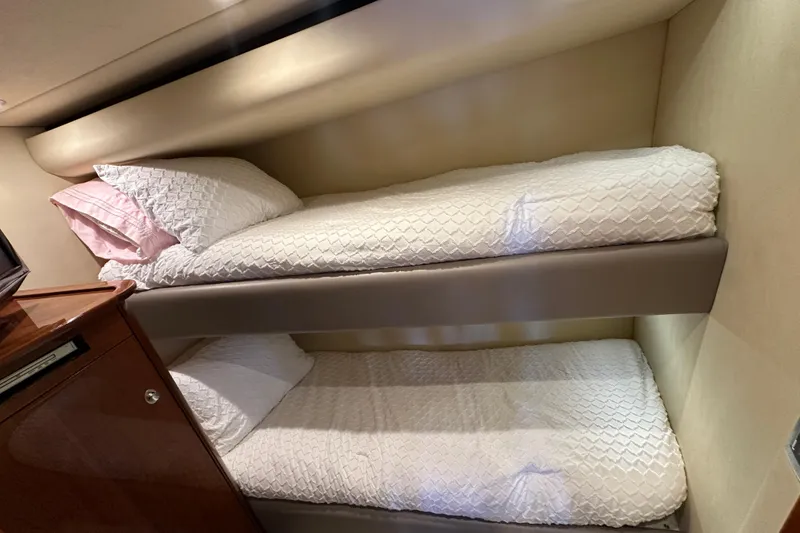 Slide: The Image of Bunk beds in 2009 Sea Ray 60 Sundancer yacht cabin, featuring white bedding. - 34