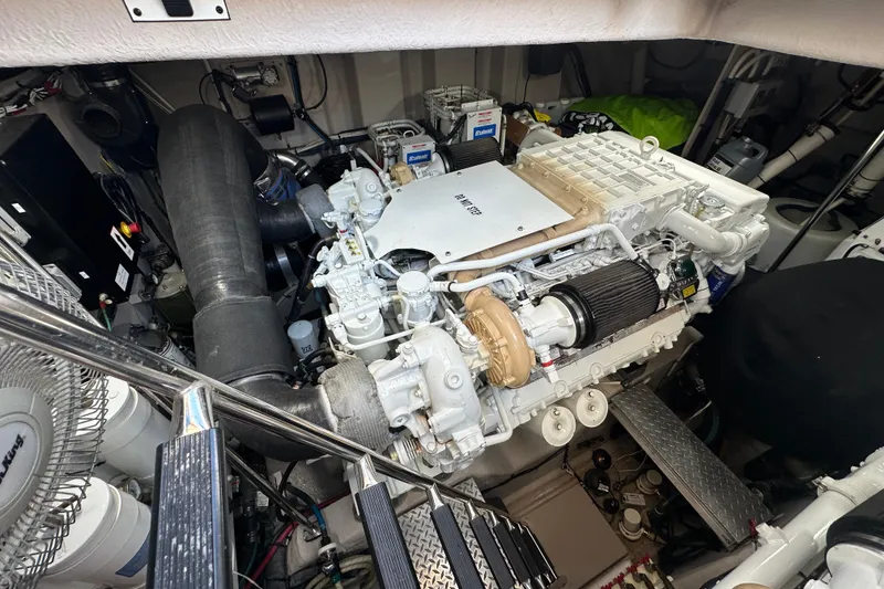 Slide: The Image of Engine room of 2009 Sea Ray 60 Sundancer yacht, showcasing detailed machinery and components. - 36