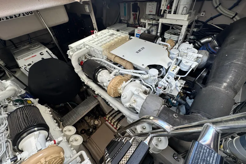 Slide: The Image of Engine room of a 2009 Sea Ray 60 Sundancer yacht, showcasing mechanical components. - 37