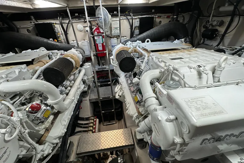 Slide: The Image of Engine room of a 2009 Sea Ray 60 Sundancer yacht, featuring dual engines and equipment. - 40