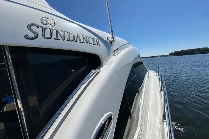 Slide: The Image of 2009 Sea Ray 60 Sundancer yacht cruising on a sunny day, side view. - 43