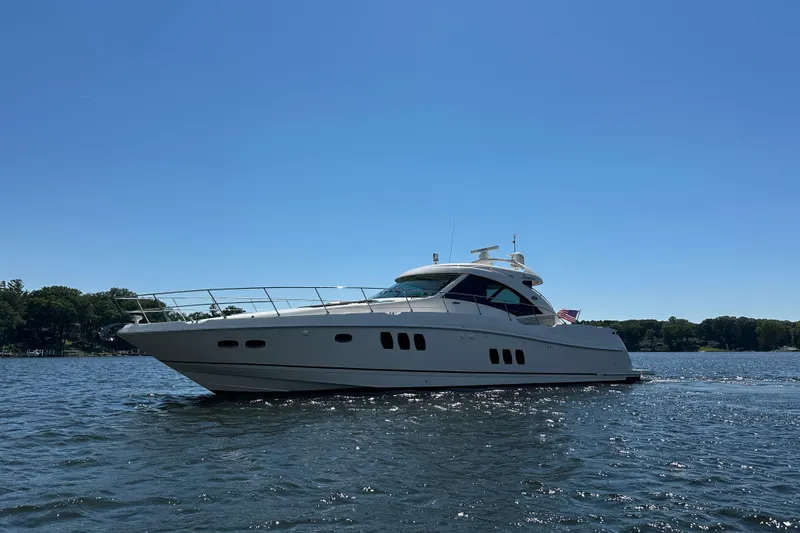 Slide: The Image of 2009 Sea Ray 60 Sundancer yacht cruising on a sunny day, surrounded by calm waters. - 46