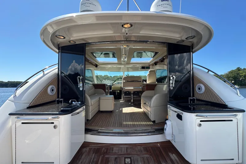 Slide: The Image of 2009 Sea Ray 60 Sundancer yacht interior with luxurious seating and modern amenities. - 5
