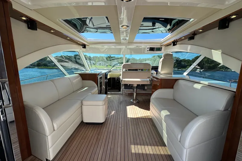 Slide: The Image of Luxurious interior of 2009 Sea Ray 60 Sundancer yacht with white leather seating. - 9