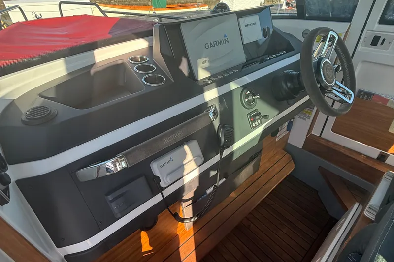 Slide: The Image of 2019 Axopar 28 CABIN helm with Garmin navigation and Mercury controls. - 15