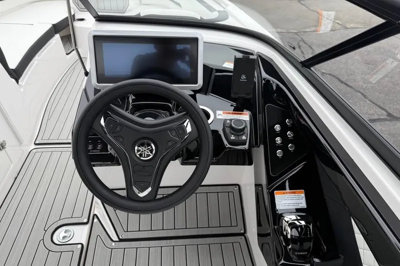 Slide: The Image of 2026 Yamaha Boats 252SD helm with modern steering and touchscreen display. - 10