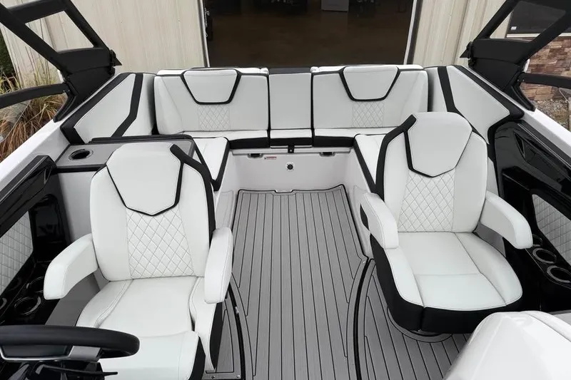 Slide: The Image of Luxurious interior of 2026 Yamaha Boats 252SD with white and black seating. - 13