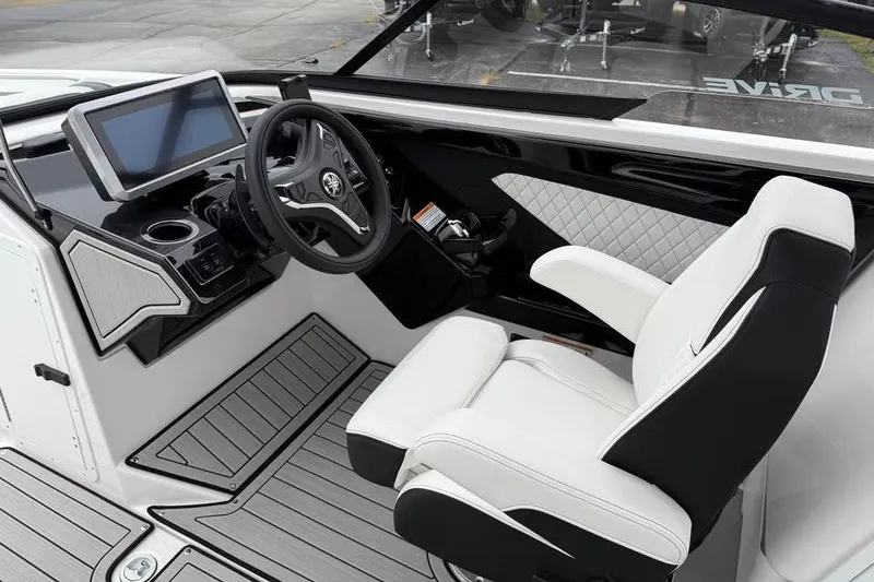 Slide: The Image of 2026 Yamaha Boats 252SD cockpit with modern steering and touchscreen display. - 9