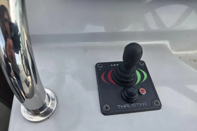 Slide: The Image of Joystick control on a 2021 Regal 26 Express boat's thruster panel. - 5