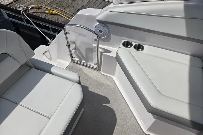 Slide: The Image of Interior of 2021 Regal 26 Express boat with seating and cup holders. - 8