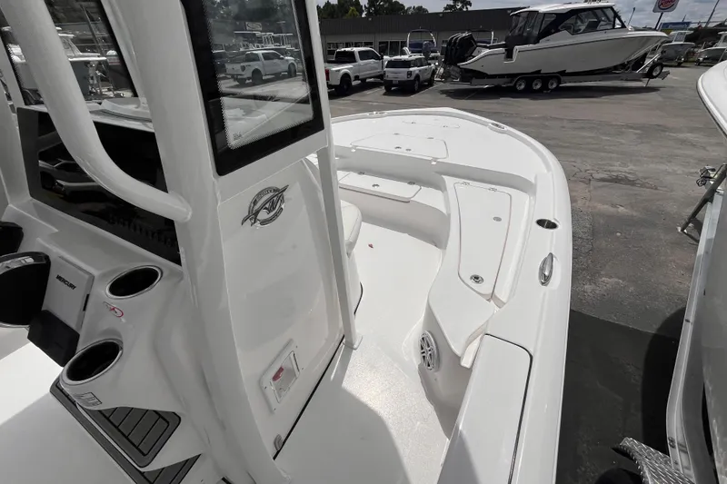 Slide: The Image of 2026 Tidewater 2210 Carolina Bay boat interior with seating and storage compartments. - 10