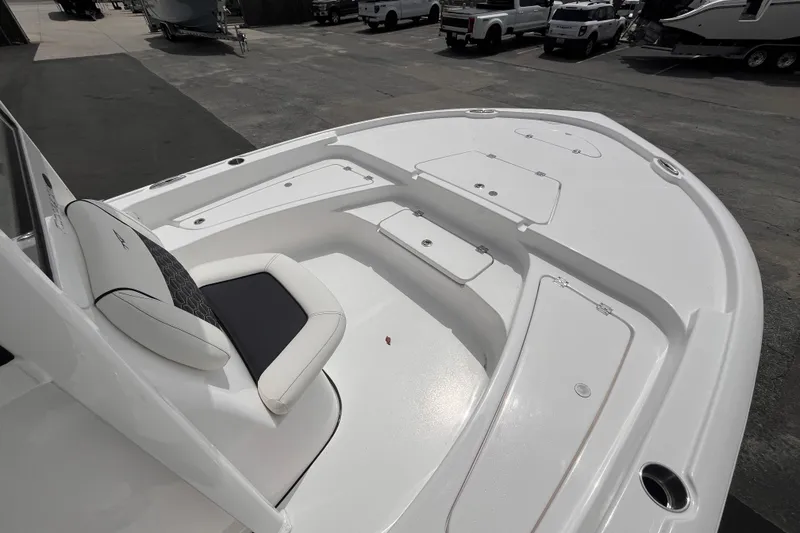 Slide: The Image of 2026 Tidewater 2210 Carolina Bay boat interior with seating and storage compartments. - 11