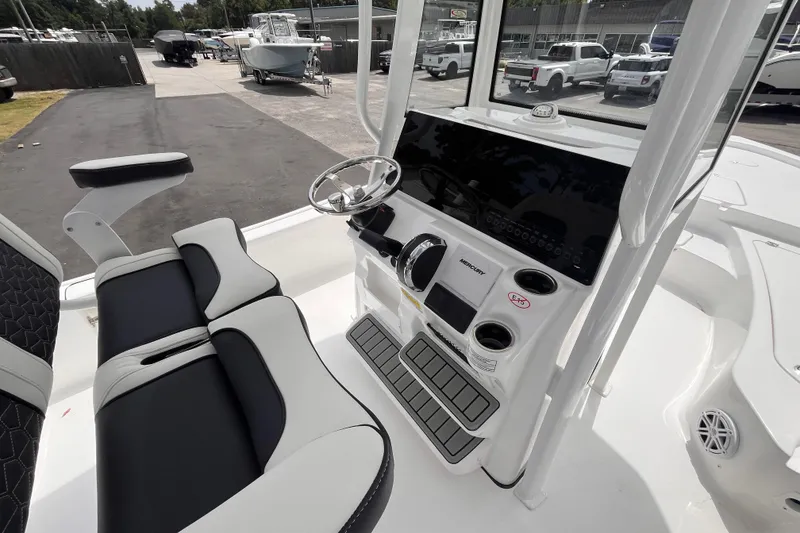 Slide: The Image of 2026 Tidewater 2210 Carolina Bay boat interior with modern helm and seating. - 8