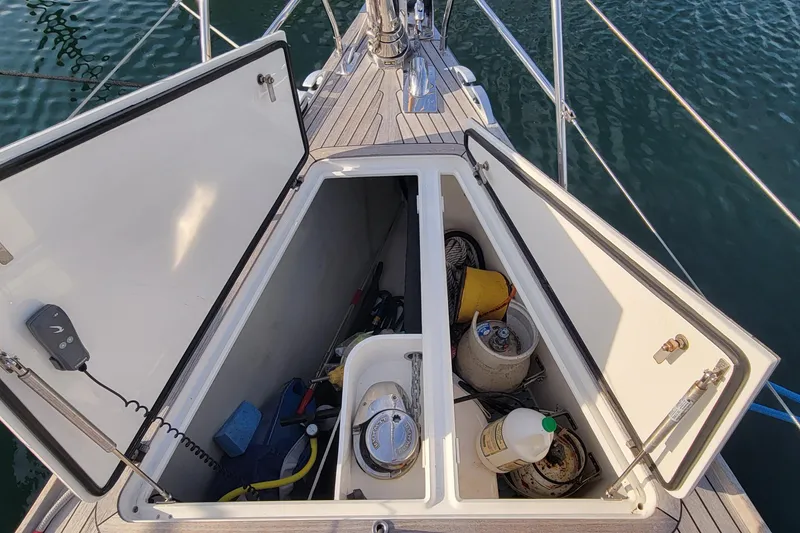Slide: The Image of Open storage compartment on 2018 Nautor Swan 54 yacht, containing various boating supplies. - 12