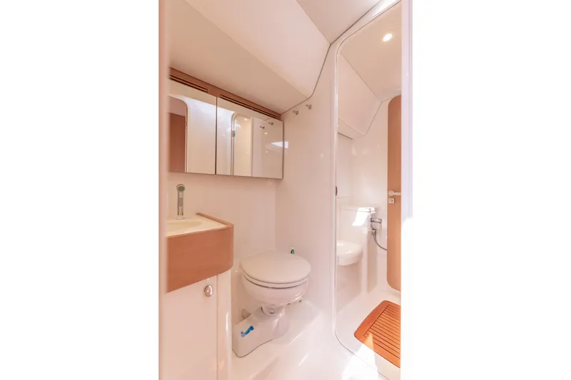 Slide: The Image of Luxurious bathroom in 2018 Nautor Swan 54 yacht, featuring modern fixtures and elegant design. - 25