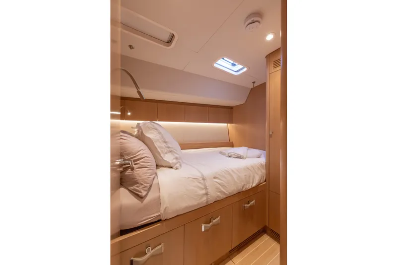 Slide: The Image of Luxurious cabin interior of 2018 Nautor Swan 54 yacht with cozy bed and modern lighting. - 29