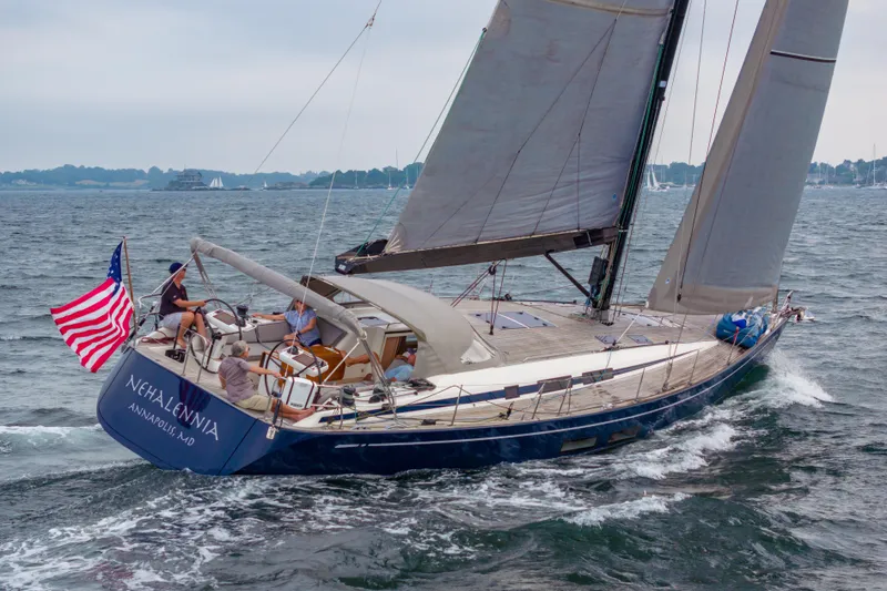 Slide: The Image of 2018 Nautor Swan 54 sailing yacht on open water with American flag. - 3