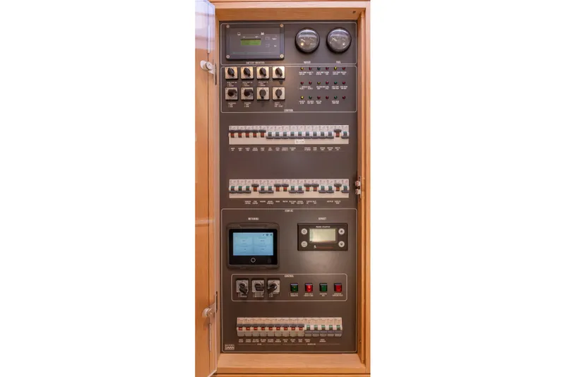 Slide: The Image of Electrical control panel of a 2018 Nautor Swan 54 yacht, featuring gauges and switches. - 30