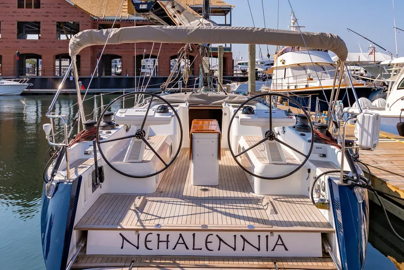 Slide: The Image of Nautor Swan 54 sailboat, 2018 model, docked at marina with dual steering wheels. - 9