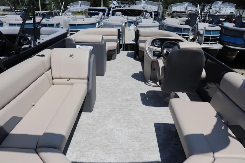 Slide: The Image of 2025 Flagship Freedom 22 CU Tritoon with spacious seating and modern helm design. - 8