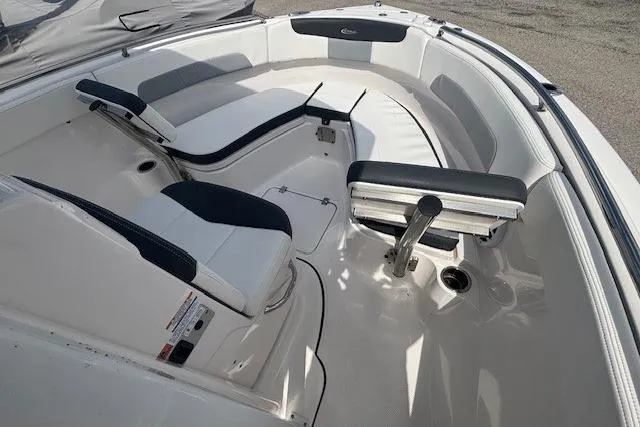 Slide: The Image of 2022 Robalo R222 Explorer boat interior with cushioned seating and sleek design. - 10