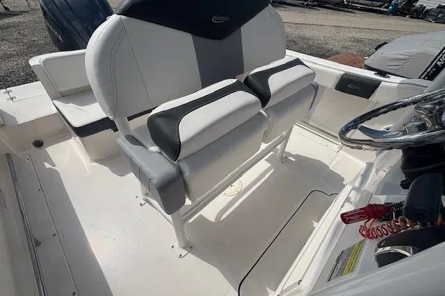 Slide: The Image of 2022 Robalo R222 Explorer boat interior with dual seating and steering wheel. - 15