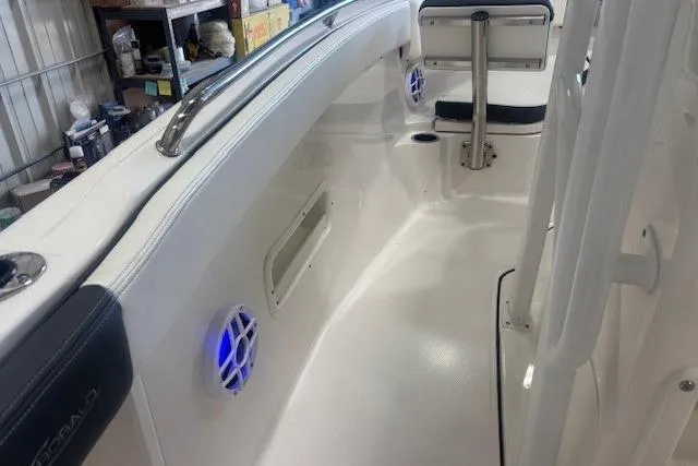 Slide: The Image of 2022 Robalo R222 Explorer boat interior with seating and blue LED lights. - 24