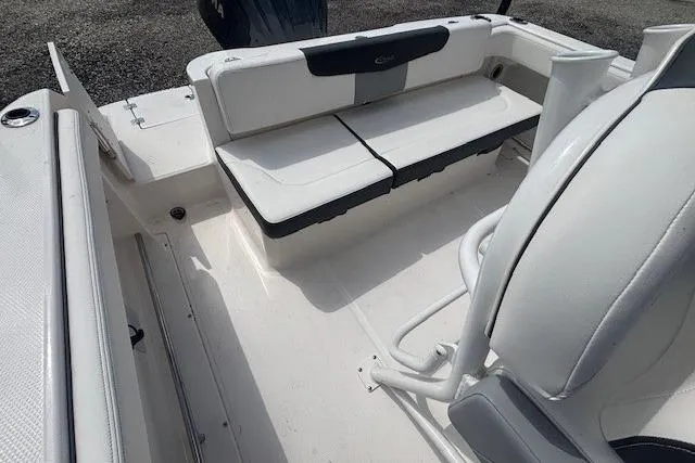 Slide: The Image of 2022 Robalo R222 Explorer boat interior with white seating and console. - 26