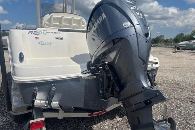 Slide: The Image of 2022 Robalo R222 Explorer boat with Yamaha 250 V6 engine, parked outdoors. - 28