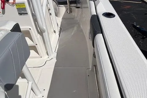 Slide: The Image of 2022 Robalo R222 Explorer boat interior with white seating and sleek design. - 38