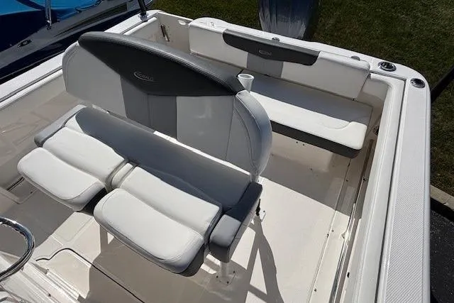 Slide: The Image of 2022 Robalo R222 Explorer boat interior with white seating and sleek design. - 43