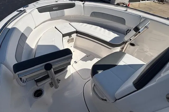 Slide: The Image of 2022 Robalo R222 Explorer boat interior with white seating and modern design. - 44