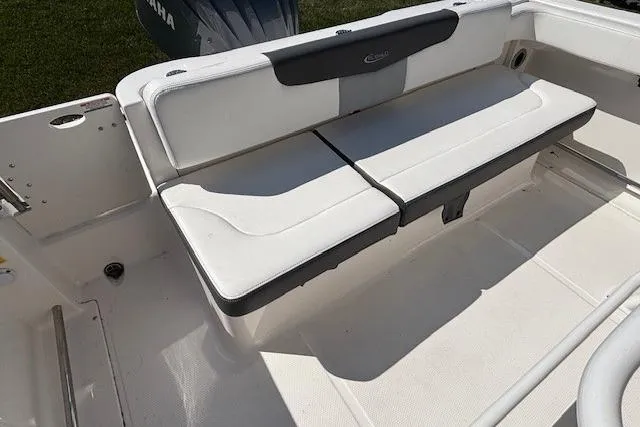 Slide: The Image of 2022 Robalo R222 Explorer boat with white cushioned seating. - 46