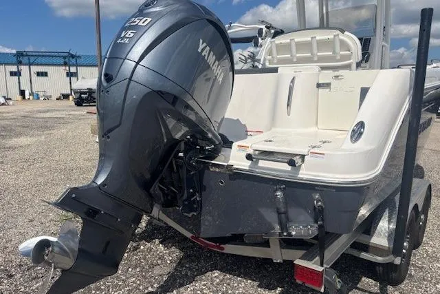 Slide: The Image of 2022 Robalo R222 Explorer boat with Yamaha V6 engine, parked on a trailer. - 7