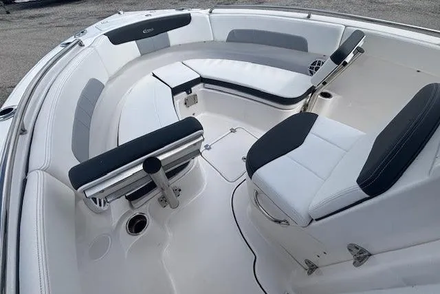 Slide: The Image of 2022 Robalo R222 Explorer boat interior with white and black seating arrangement. - 9