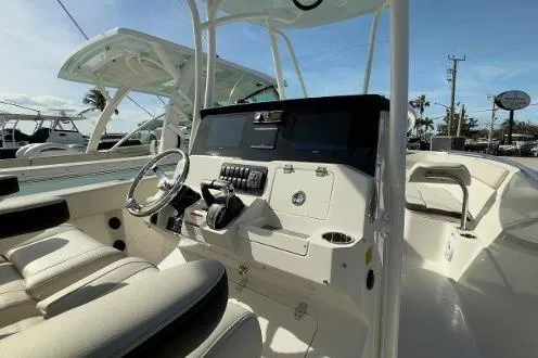 Slide: The Image of 2024 Sailfish 242 CC boat interior with modern helm and seating. - 22