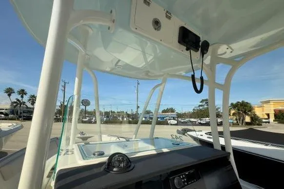 Slide: The Image of 2024 Sailfish 242 CC boat interior with console and overhead view. - 6