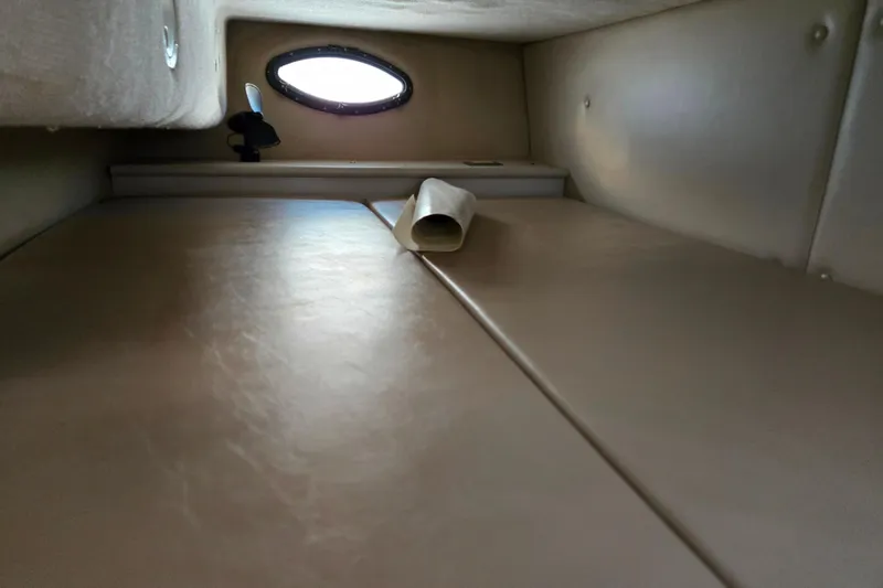 Slide: The Image of Interior cabin of a 1995 Regal Commodore 258 boat with porthole window. - 7