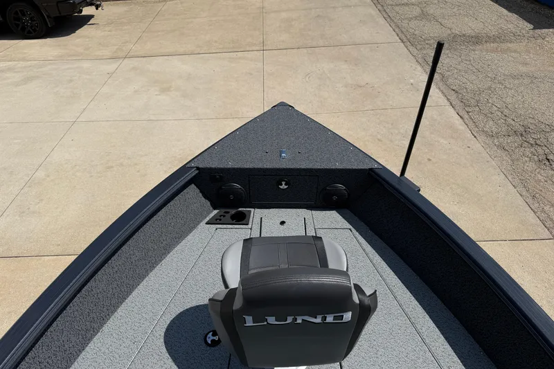 Slide: The Image of 2025 Lund 2075 Impact XS boat interior with seating and storage compartments. - 10