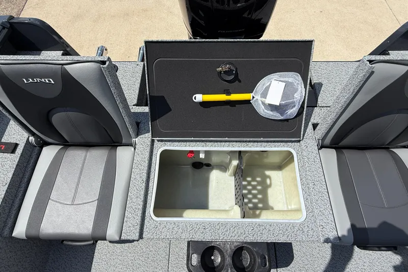 Slide: The Image of 2025 Lund 2075 Impact XS boat interior with storage compartment and seating. - 27