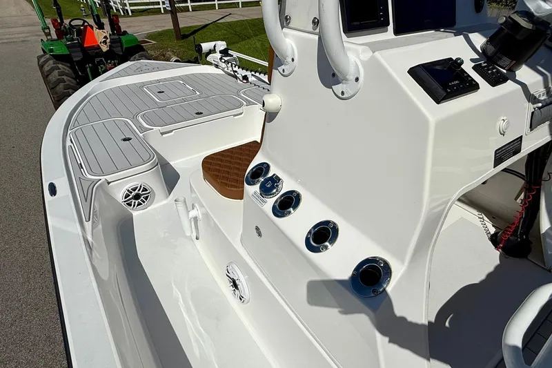 Slide: The Image of 2022 Shallow Sport 24 Modified V boat interior with sleek design and modern controls. - 12