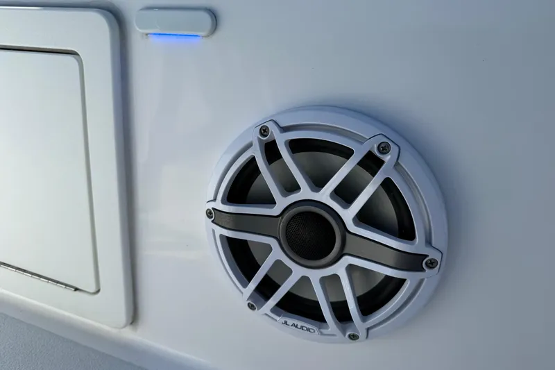 Slide: The Image of White speaker on 2022 Shallow Sport 24 Modified V boat with blue LED light. - 18