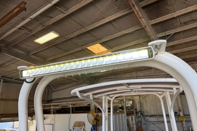 Slide: The Image of LED light bar on 2022 Shallow Sport 24 Modified V boat in a warehouse. - 19