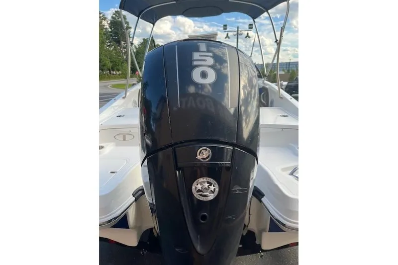 Slide: The Image of 2018 Tahoe 550 TF boat with a 150 horsepower Mercury outboard motor. - 4