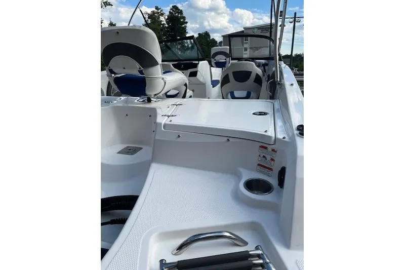 Slide: The Image of Interior view of a 2018 Tahoe 550 TF boat, featuring seating and storage compartments. - 5
