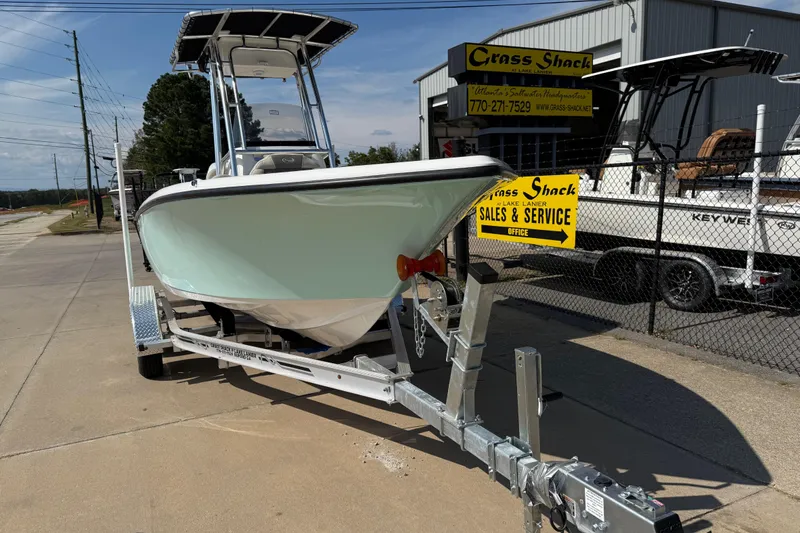 Slide: The Image of 2026 Key West 203 FS boat on trailer at sales and service center. - 1