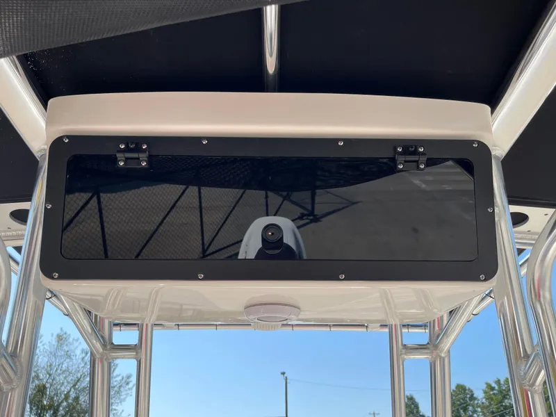 Slide: The Image of 2025 Key West 203 FS boat console with storage compartment and sleek design. - 13